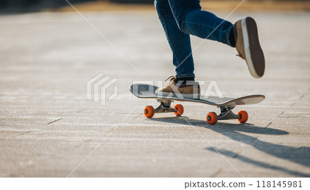 People skateboarding in modern city 118145981