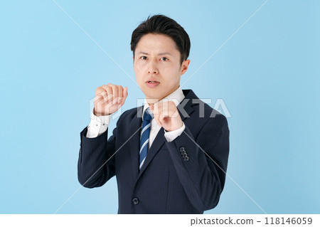 Businessman in a fighting pose Businessman in a fighting pose 118146059