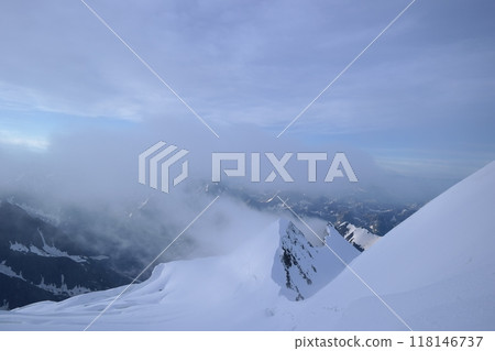Tranquil Lake With Lush Green Forest, Snow-Capped Mountain, Blue Sky And White Clouds Tranquil Lake With Lush Green Forest, Snow-Capped Mountain, Blue Sky And White Clouds 118146737