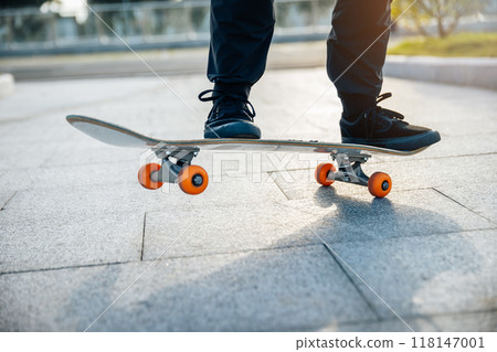 Skateboarder skateboarding outdoors in city 118147001
