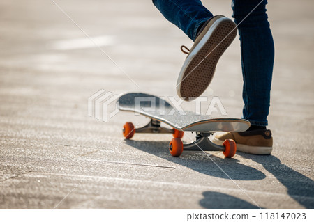 People skateboarding in modern city People skateboarding in modern city 118147023