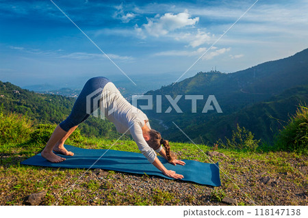 Young sporty fit woman doing yoga oudoors in mountains 118147138