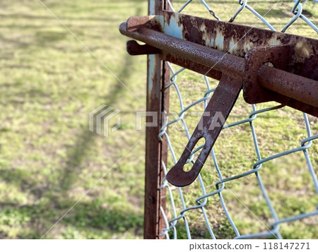 Rusty fence door and lawn Rusty fence door and lawn 118147271