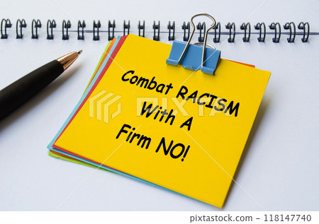 Combat Racism With A Firm No text on yellow notepad. No to negativity concept 118147740