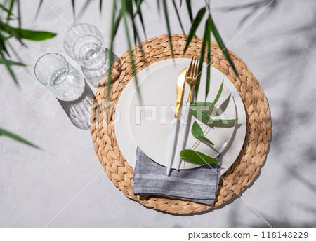 Festive table setting with white plates and glasses for a spring celebration, wedding, birthday 118148229