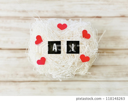 The letter AI surrounded by heart-shaped paper _ on white paper packing The letter AI surrounded by heart-shaped paper _ on white paper packing 118148263