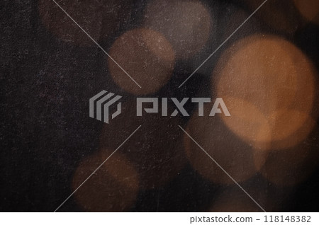 Abstract bokeh texture background with orange and brown circles from a garland  118148382