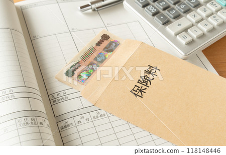 Insurance premiums in an envelope and a household account book Insurance premiums Insurance premiums in an envelope and a household account book Insurance premiums 118148446