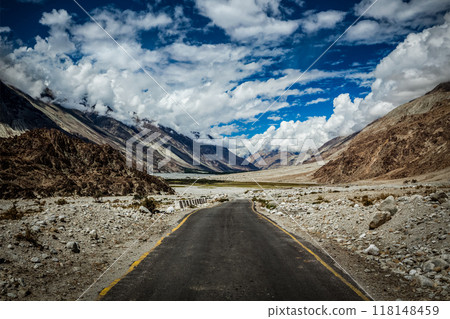 Road in Himalayan landscape in Nubra valley in Himalayas Road in Himalayan landscape in Nubra valley in Himalayas 118148459
