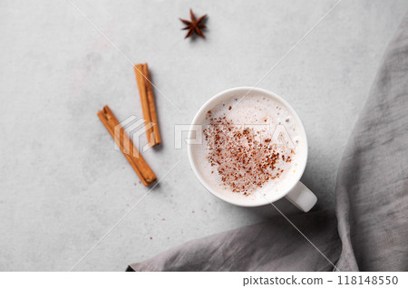 White mug of hot cocoa or chocolate with whipped cream, cinnamon sticks and star anise White mug of hot cocoa or chocolate with whipped cream, cinnamon sticks and star anise 118148550