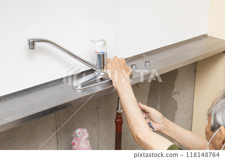 Kitchen faucet replacement work Kitchen faucet replacement work 118148764