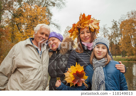 Cheerful family generation in park in autumn, portrait Cheerful family generation in park in autumn, portrait 118149013