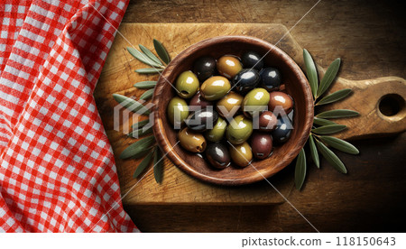 Olive Wooden Bowl Full of Fresh Olives above a Cutting Board - Generative Ai 118150643