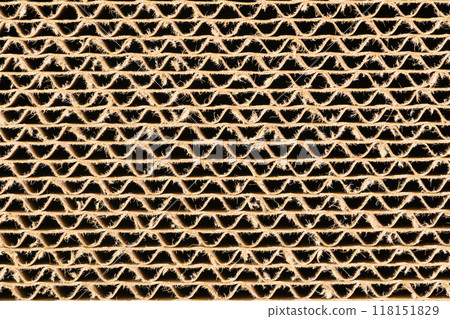 Closeup view of corrugated cardboard use as a scratching post for cat. Closeup view of corrugated cardboard use as a scratching post for cat. 118151829