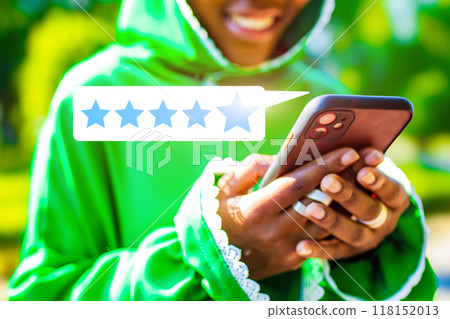A person is holding a cell phone with a star rating on it 118152013