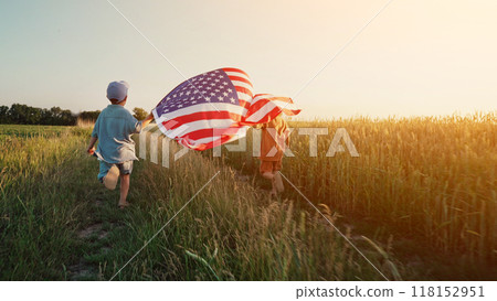 Cute little boys - American patriot kids running with national flag. USA, 4th of July - Independence day, celebration. 118152951