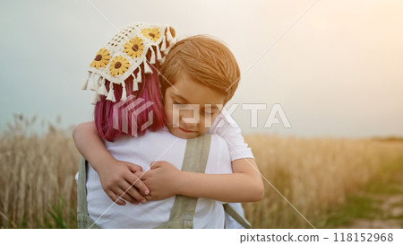 Tender scene of loving son with mom in wheat field, rustic country backdrop. Beautiful family. Cute 5 years old kid with mother. Parenthood, childhood, happiness, children wellbeing concept. Tender scene of loving son with mom in wheat field, rustic country backdrop. Beautiful family. Cute 5 years old kid with mother. Parenthood, childhood, happiness, children wellbeing concept. 118152968