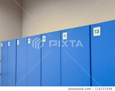 A row of blue lockers numbered 1 through 13 in a clean and organized locker room A row of blue lockers numbered 1 through 13 in a clean and organized locker room 118153598