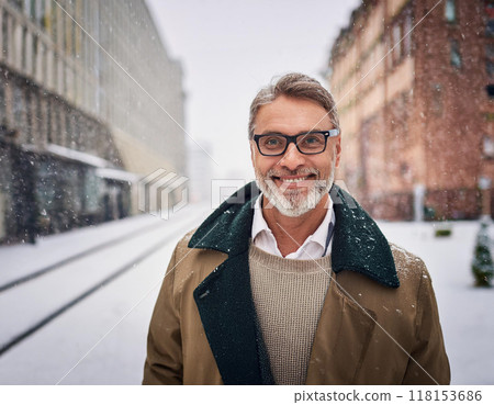 Winter Portrait of Happy Handsome Man Smiling Outdoors 118153686