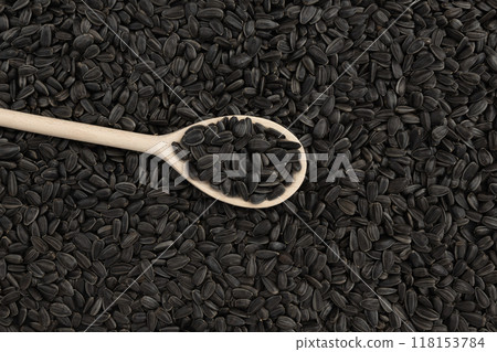 background of black sunflower seeds, close up 118153784