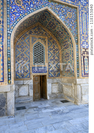 A small wooden door in the Tillya-Kori madrasah and portal of XV century in Samarkand, Uzbekistan 118153840