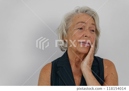 A Thoughtful Senior Woman is Reflecting with Grace and Poise on Lifes Many Aspects A Thoughtful Senior Woman is Reflecting with Grace and Poise on Lifes Many Aspects 118154014