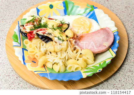 Fried Egg with Sausage and Pasta on a Plate 118154417