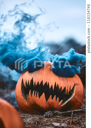 Evil orange Pumpkin with blue smoke 118154748
