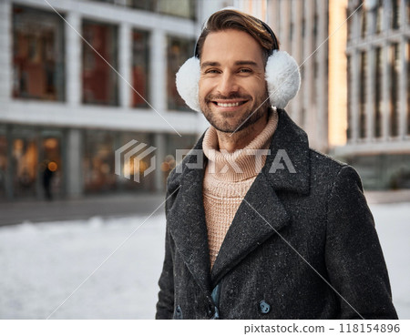 Winter Portrait of Happy Handsome Man Smiling Outdoors 118154896