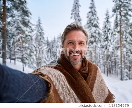 Winter Portrait of Happy Handsome Man Smiling Outdoors Winter Portrait of Happy Handsome Man Smiling Outdoors 118154979