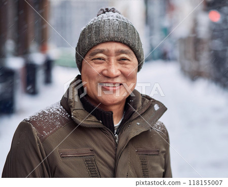 Winter Portrait of Happy Handsome Man Smiling Outdoors 118155007