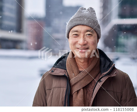 Winter Portrait of Happy Handsome Man Smiling Outdoors 118155008
