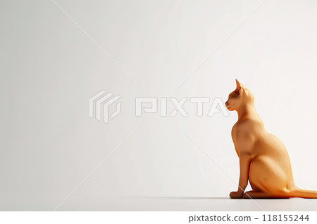 Light Brown Cat Figurine Positioned on White-to-Gray Gradient Background with Space for Text or Creative Design 118155244
