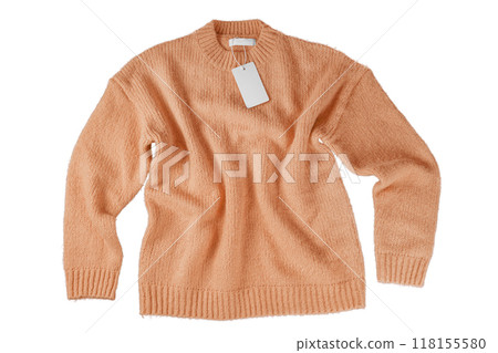 Orange flying crumpled women autumn knitted sweater with label tag isolated on white background 118155580