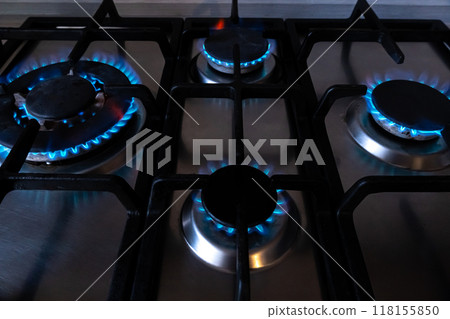 Blue fuel burns in a gas stove burner. Strategic natural gas reserves. Liquefied methane, butane or propane gas. Natural resources. Fire Blue fuel burns in a gas stove burner. Strategic natural gas reserves. Liquefied methane, butane or propane gas. Natural resources. Fire 118155850