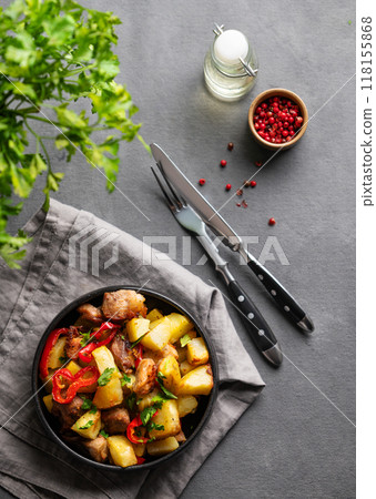 Fried pork meat with potatoes, onions and peppers. National homemade Georgian dish ojakhuri 118155868