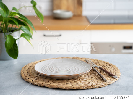 Wooden blue table top with flower pot and plate for breakfast 118155885