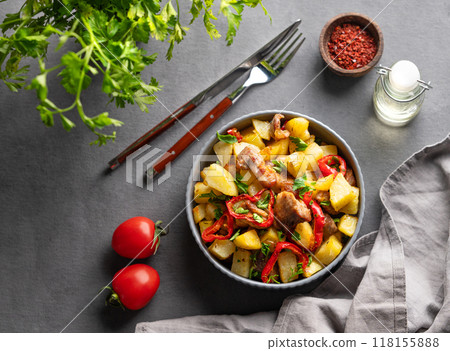 Fried pork meat with potatoes, onions and peppers. National homemade Georgian dish ojakhuri 118155888