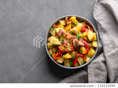 Fried pork meat with potatoes, onions and peppers. National homemade Georgian dish ojakhuri 118155894