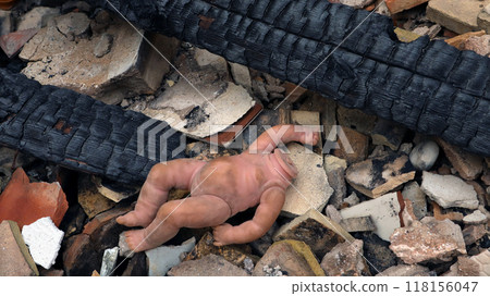 In aftermath of devastating fire, lifeless doll lies among debris of burnt building, showcasing tragic impact on community. In aftermath of devastating fire, lifeless doll lies among debris of burnt building, showcasing tragic impact on community. 118156047