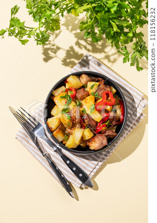 Fried pork meat with potatoes, onions and peppers. National homemade Georgian dish ojakhuri 118156232