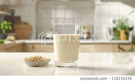 Fresh Soy Milk in a Clear Glass on Modern Kitchen Counter. PlantBased Beverage for Health and Nutrition. High Quality Stock Photo for Culinary Design and Promotion. 118156339