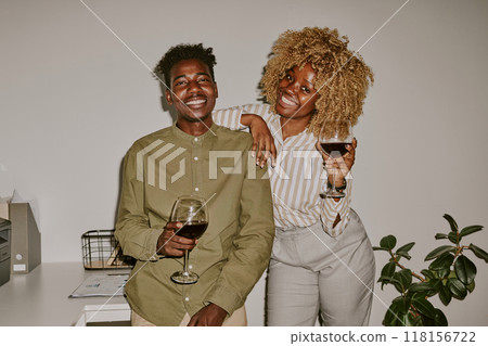 Smiling people posing for photo together while hanging out 118156722