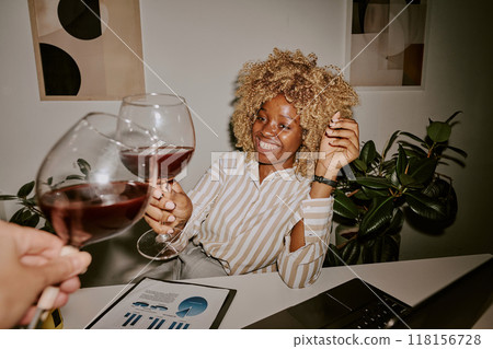 Unrecognizable man and black woman clinking glasses during break after business meeting Unrecognizable man and black woman clinking glasses during break after business meeting 118156728