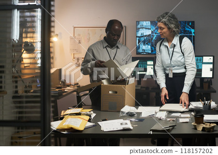 Collaborating on Research Project in Office Setting Collaborating on Research Project in Office Setting 118157202