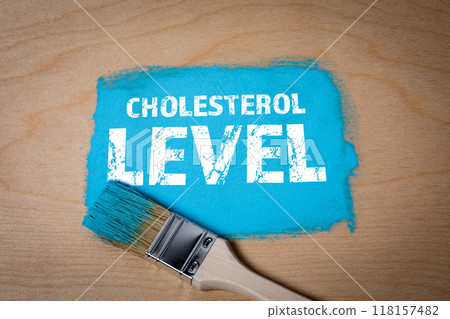 Cholesterol LEVEL. Blue paint and brush on wood texture background Cholesterol LEVEL. Blue paint and brush on wood texture background 118157482
