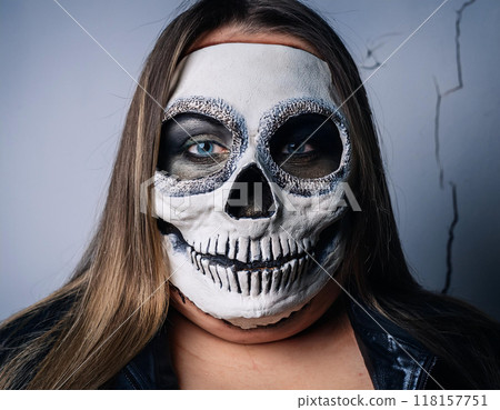Woman in Skull and Bone Mask Day of the Dead Concept 118157751