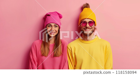 Portrait of stylish modern happy smiling woman and man, cheerful young couple on colorful background 118158094