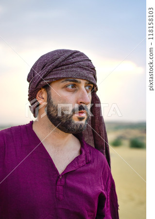 Portrait of Mature Masculine Spanish model with beard looking desert sunset calm Portrait of Mature Masculine Spanish model with beard looking desert sunset calm 118158103
