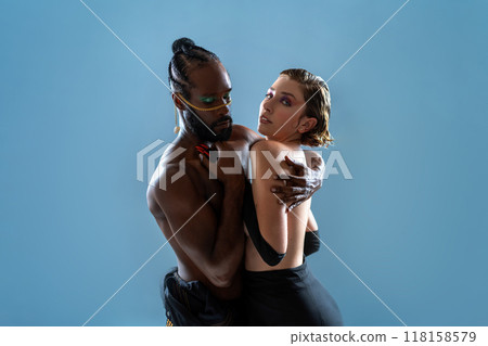 Black gay man dancing with girlfriend in blue Black gay man dancing with girlfriend in blue 118158579